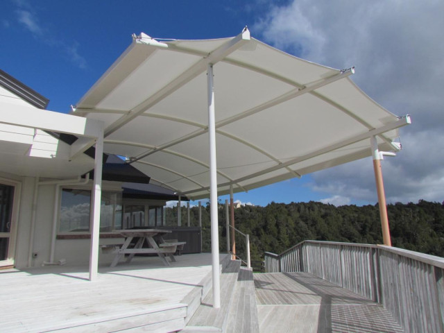 Painted canopy frame over wooden deck